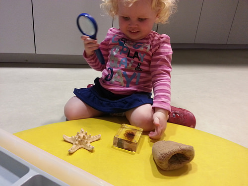 Toddler doing science in the Investigate Centr... Toddler doing science in the Investigate Centr...