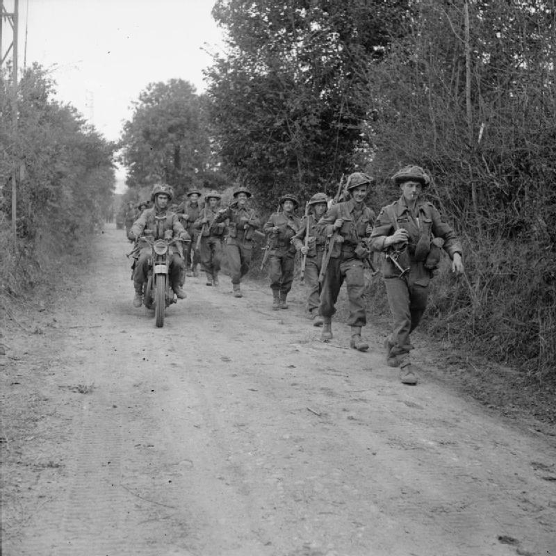 A motorcycle and infantry of the 2nd Glasgow H... A motorcycle and infantry of the 2nd Glasgow H...