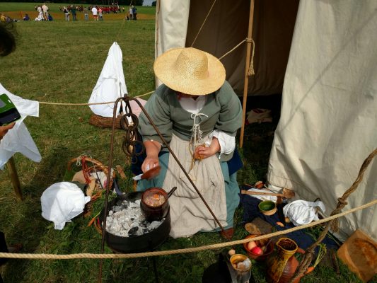 Cooking snacks for soldiers at a living history event