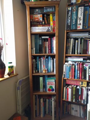 The thinnest upstairs bookshelf is the academic bookshelf, which has a lot of university textbooks on it