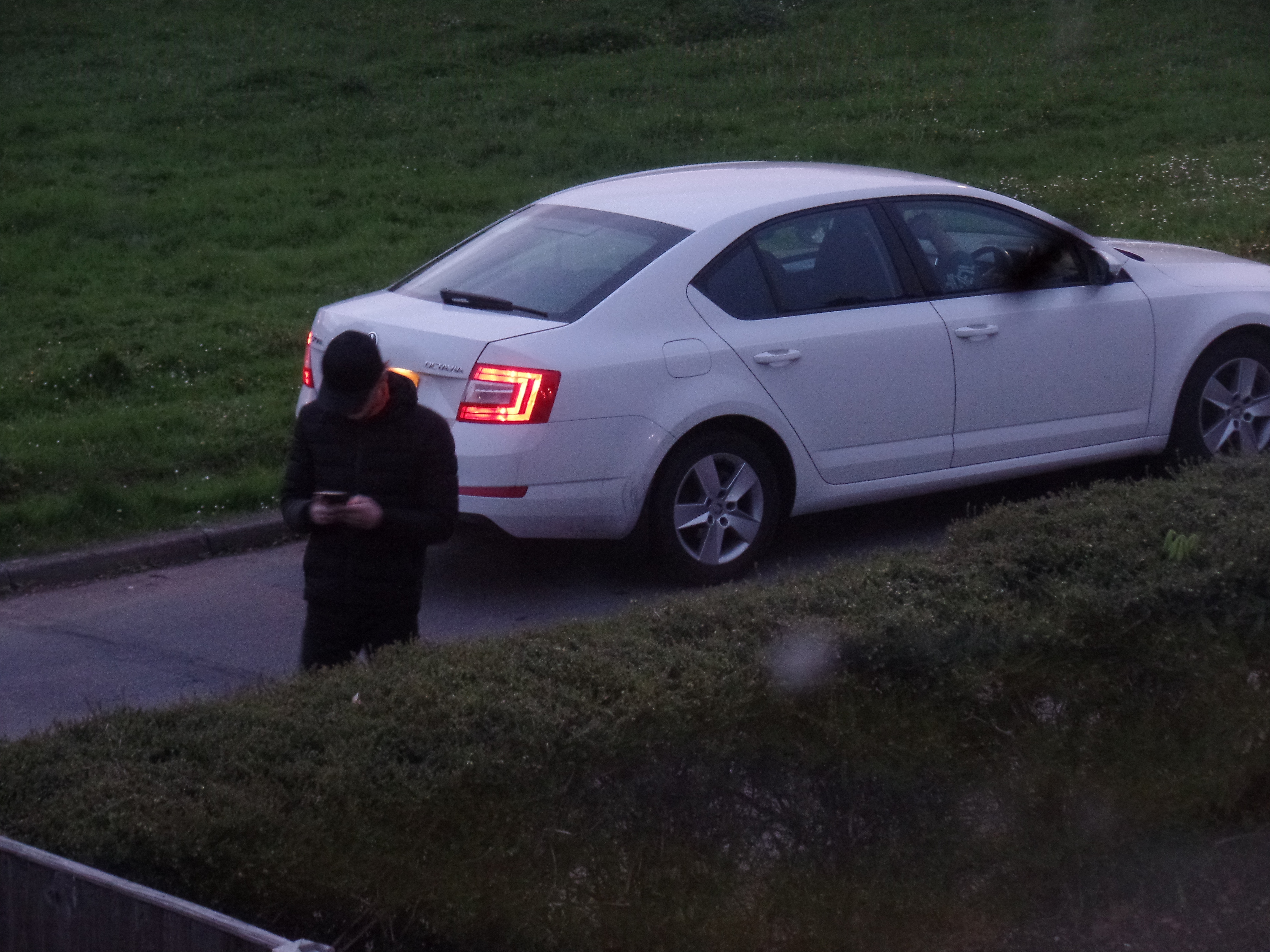 Two members of the reality TV production crew on the street outside my house during filming