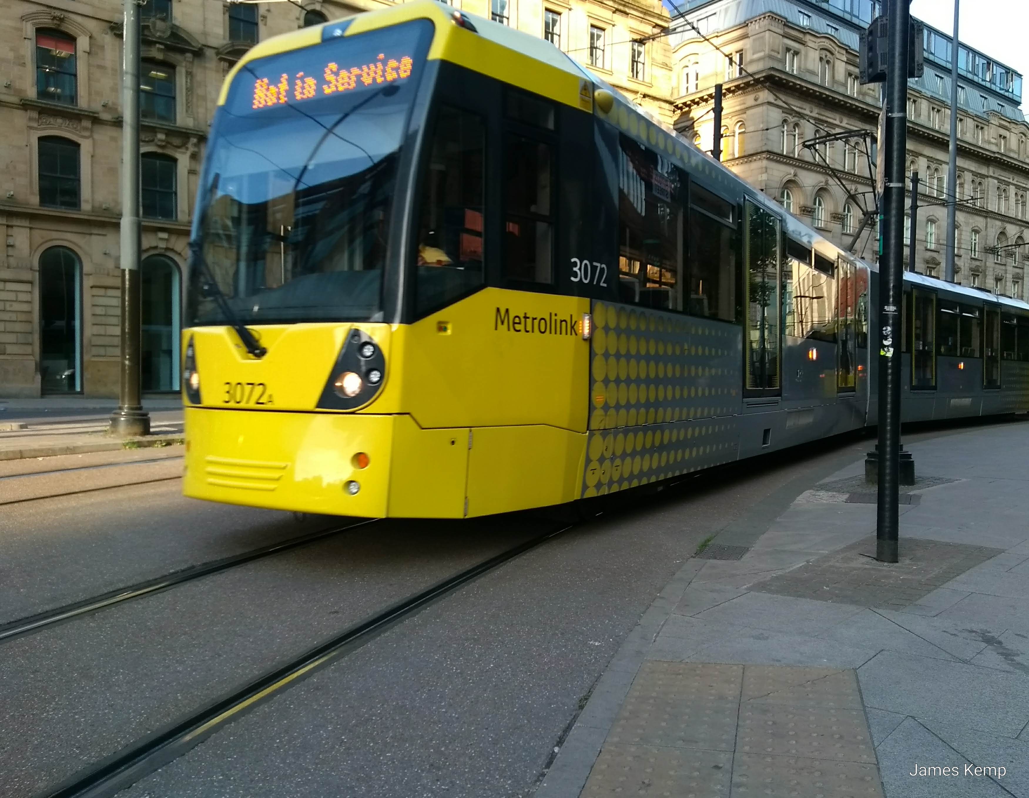 A yellow Manchester tram