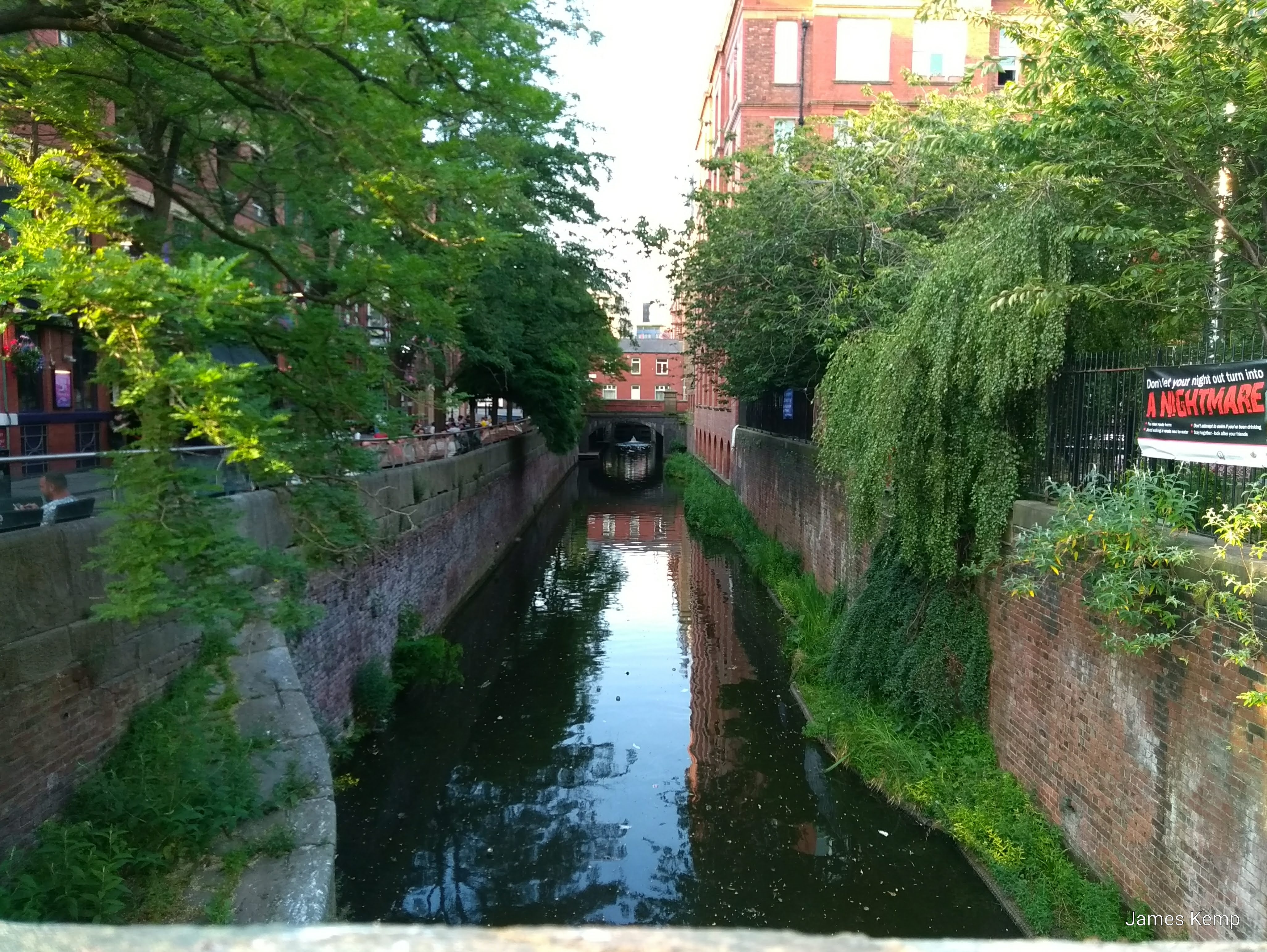 A Manchester canal, running alongside Canal Street (right) and Sackville Park (left). (Photo: James Kemp)