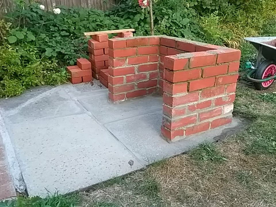 brick barbecue being built seventh course complete